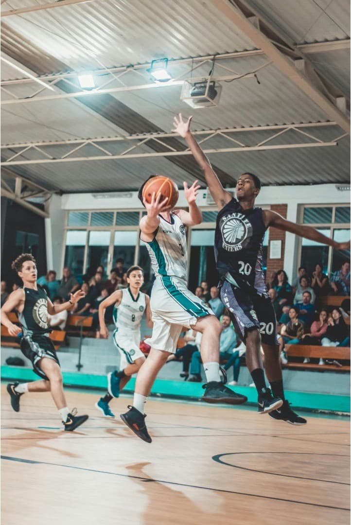 College student-athlete competing in a basketball game