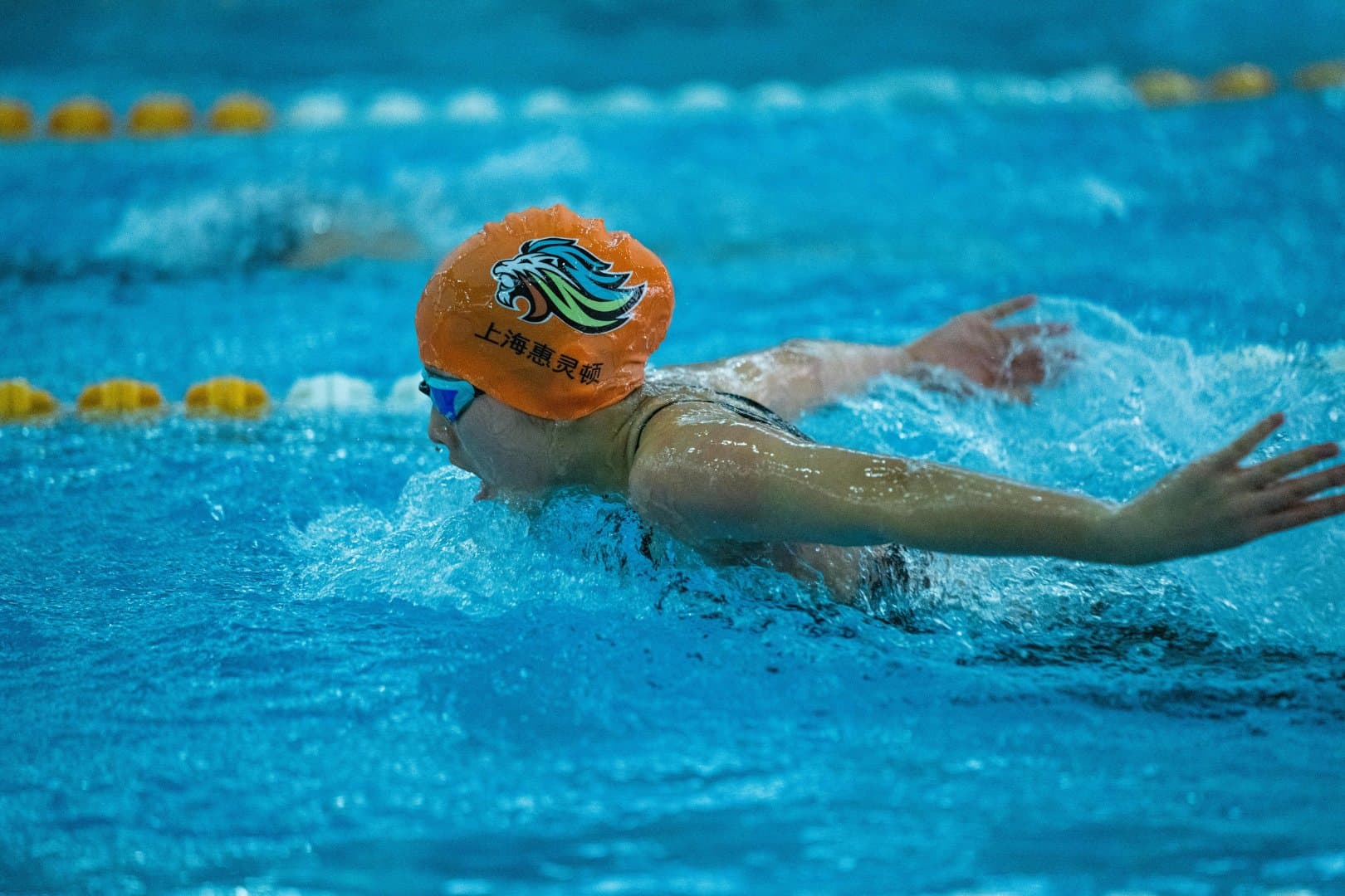 Swimmer powering through the butterfly stroke